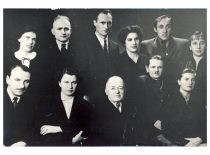 KPI Department of Organic Chemistry celebrates the 75th anniversary of the head of the department prof. A. Purėnas, 1957. Sitting from the left to the right: doc. R. Baltrušis, doc. L. Rasteikienė, prof. A. Purėnas, doc. V. Šukys, assist. L. Ivaškevičienė; standing: J. Sruogaitė, doc. F. Staniulis, lab. assist. L. Vaškelis, lab. assist. L. Vėsienė, lab. assist. A. Mačiulis, lab. assist. J. Baltrušienė.