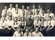Students of Raseiniai Gymnasium with their teacher, 1940. E. Sto&scaron;kutė is the 1st from the right in the 2nd row. (photograph by D. Zolinas) (E. Grinienė family archive)