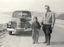 Prof. K. Bar&scaron;auskas with his son Petras by a car, 1960. (the original photograph is at Prof. K. Bar&scaron;auskas family archive)