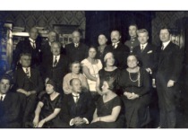 Banquet at M. Sleževičius house, circa 1925. In the photograph (from the left), 1st row: 3rd is Z. Žemaitis, 4th is S Žemaitienė. 2 row: 1st is K. Grinius, 2nd is T. Naru&scaron;evičius, 3rd is F. Bortkevičienė, 4th is D. Sleževičienė, 5th is E. Sleževičienė. 3rd row: 3rd is V. Jurgutis, 5th is M. Sleževičius, 6th is V. Sidzikauskas. (the original photograph is at KTU Museum)