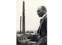 J. Indriūnas next to the chimney he designed for the boiler house of the 'Drobė' factory, nearing completion, 1938 (KTU Museum)