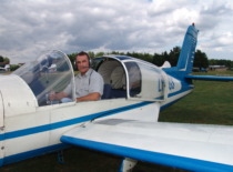 Prof. A. Fedaravičius receiving his pilot's license on a plane, 2005 (Prof. A. Fedaravičius family archive)