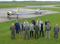 Prof. A. Fedaravičius with pilots S. Darius and S. Girėnas at the airfield, 2006 (Prof. A. Fedaravičius family archive)