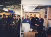 Prof. A. Fedaravičius at the KTU Institute of Defense Technology booth at the exhibition, 2002 (Photo by J. Klėmanas, KTU Photo Archive)