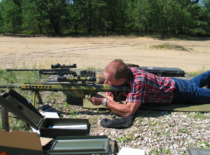 Prof. A. Fedaravičius tests shooting equipment at the firing range, 2012 (KTU Museum)